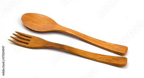 Wooden spoon and fork isolated on white background
