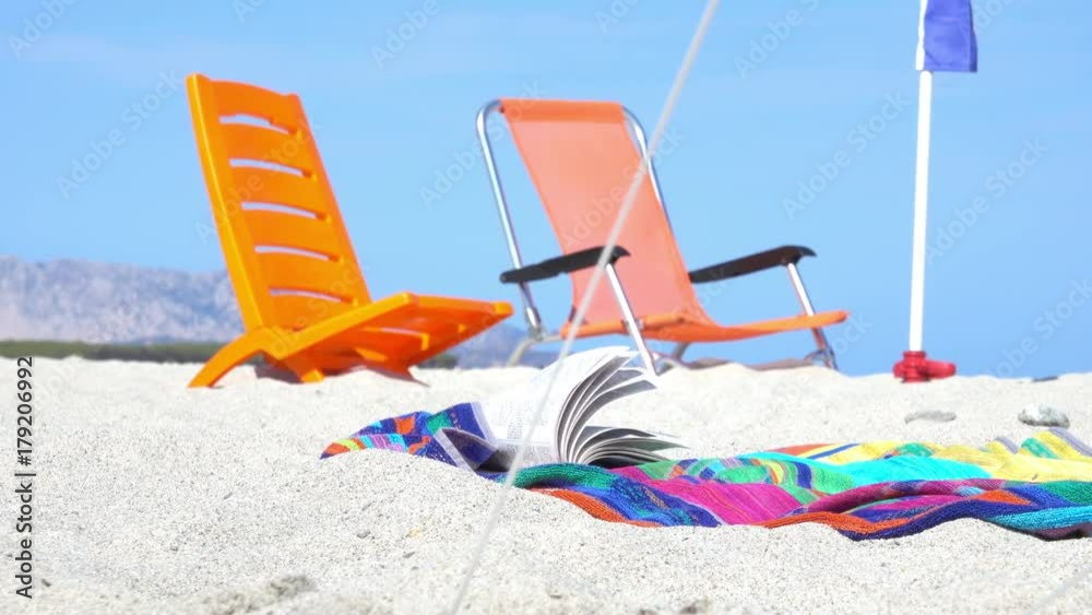 Orange Beach Chairs and Sea Towel on White Sand Beach in Summer Orange Beach Chairs and Sea Towel on White Sand Beach in Summer