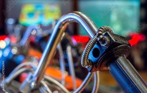 Close up on a Handle of an Arcade Motorbike with Bokeh Background
