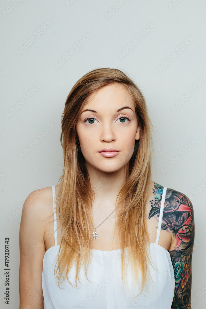 Blonde girl with large tattoo