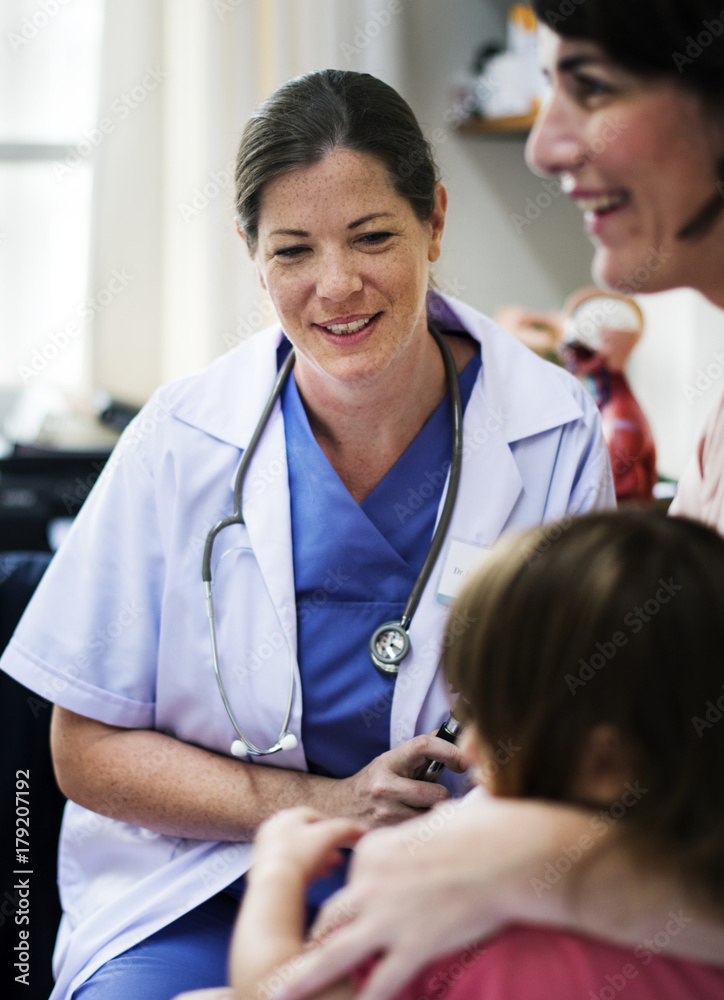 Young patient getting checked by a doctor Young patient getting checked by a doctor
