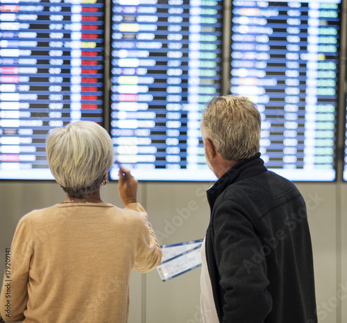 Senior couple traveling airport scene