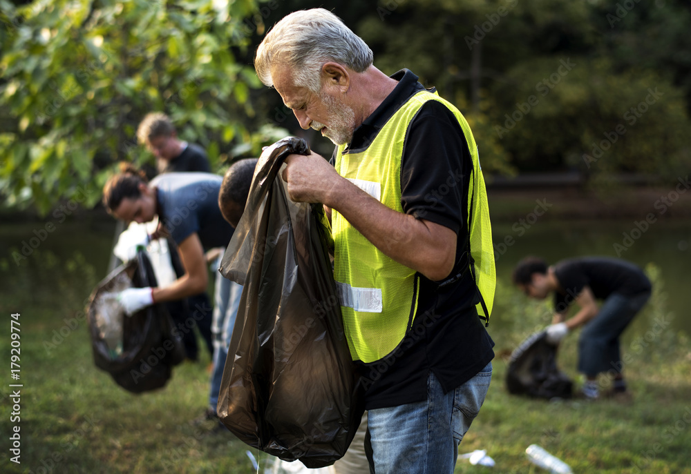 Ecology group of people cleaning the park Ecology group of people cleaning the park