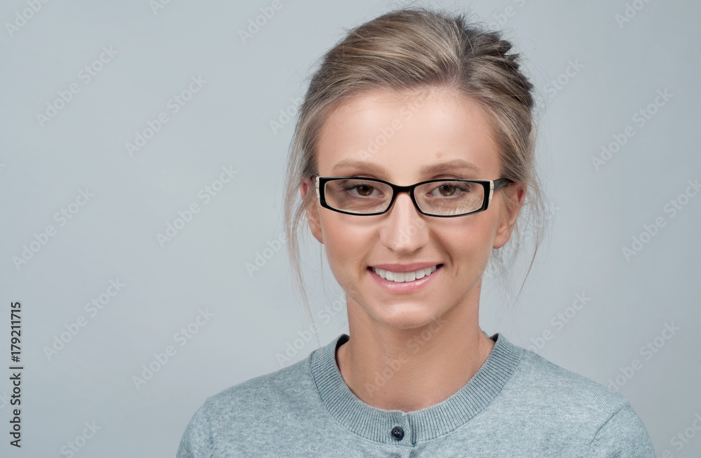 Young woman checking new eyeglasses
