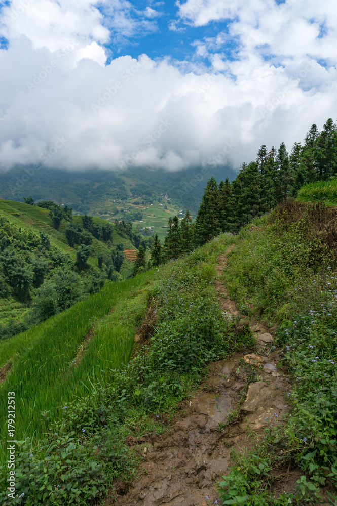 Naklejka premium Mud track with picturesque landscape of mountain valley