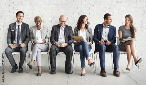 Group of diverse people are waiting for a job interview photo