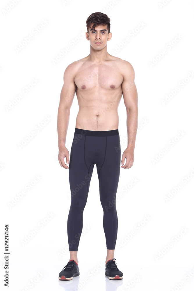 Full body length portrait of a young man wearing fitness sporty outfit Full body length portrait of a young man wearing fitness sporty outfit