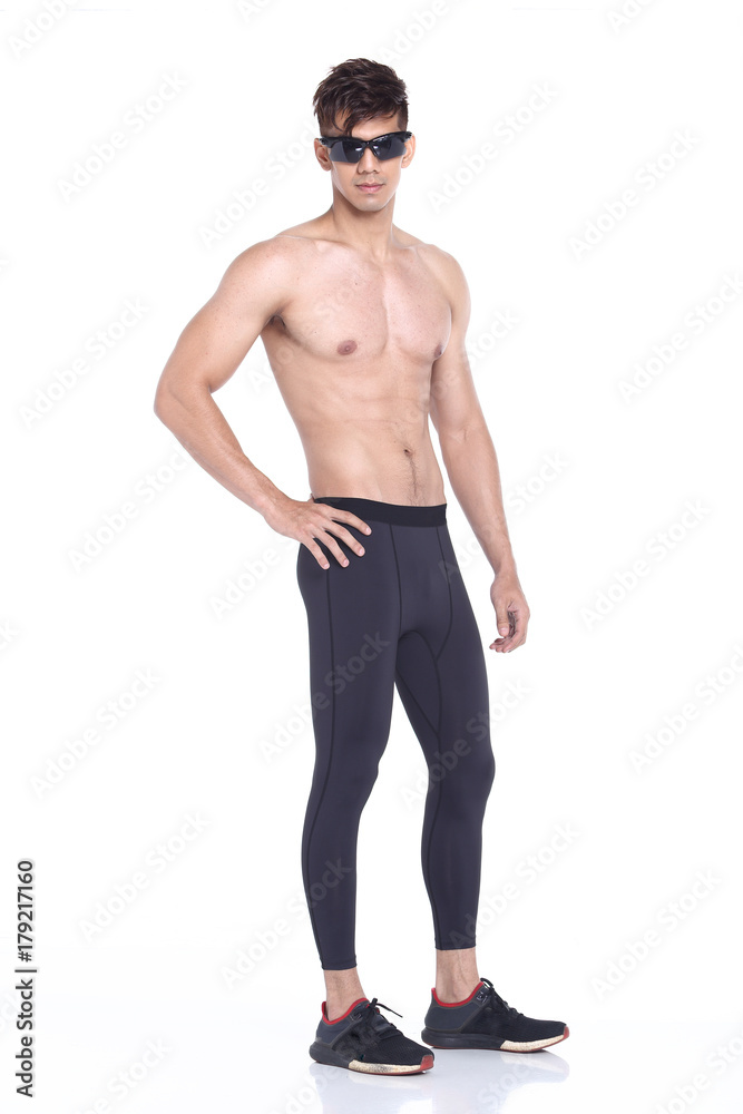 Full body length portrait of a young man wearing fitness sporty outfit Full body length portrait of a young man wearing fitness sporty outfit