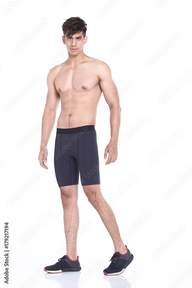 Full body length portrait of a young man wearing fitness sporty outfit Full body length portrait of a young man wearing fitness sporty outfit
