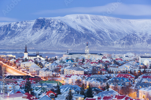 Iceland, Reykjavik, elevated view over the Churches and cityscape of Reykjavik with a backdrop of snow capped mountains