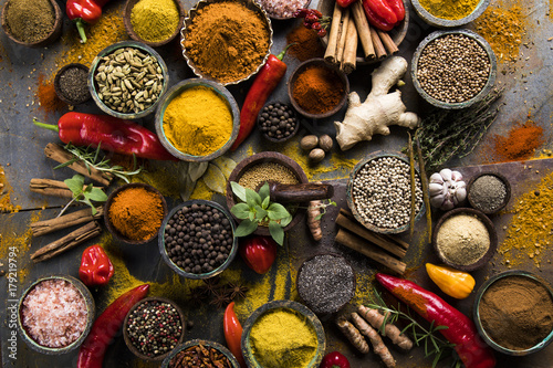 Fototapeta Naklejka Na Ścianę i Meble -  Spices and herbs in wooden bowls. Food and cuisine ingredients