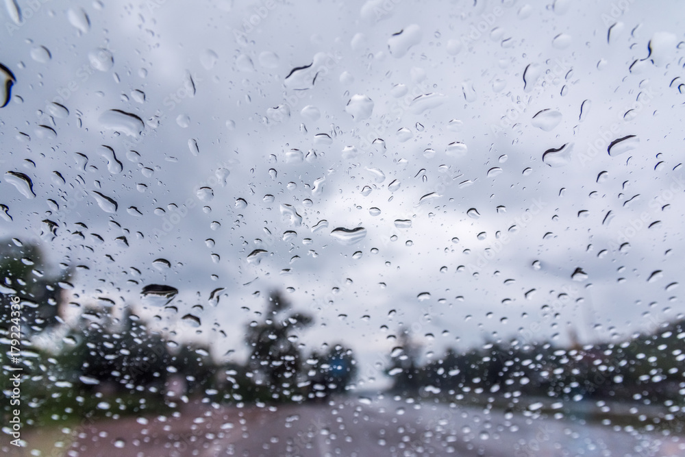Water drop on glass with road and tree In the rain. Water drop on glass with road and tree In the rain.