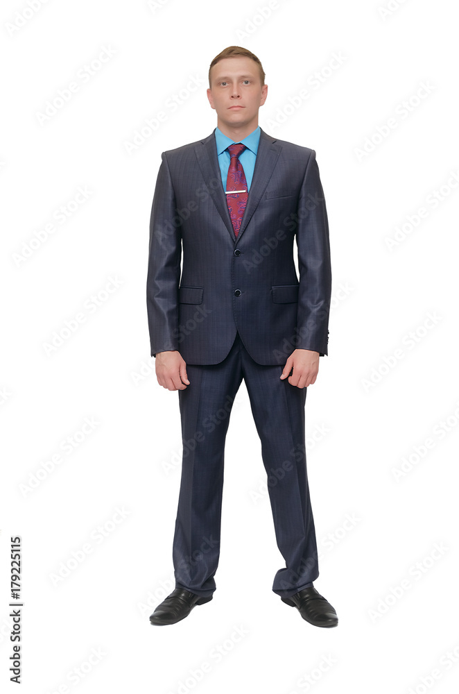 Standing serious business man with his hands down isolated on white background. Standing serious business man with his hands down isolated on white background.