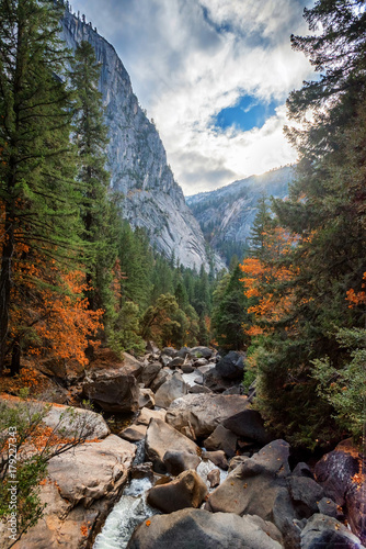 Yosemite Valley, as seen from Valley View scenic point, at the bank of the Merced River on an autumn day