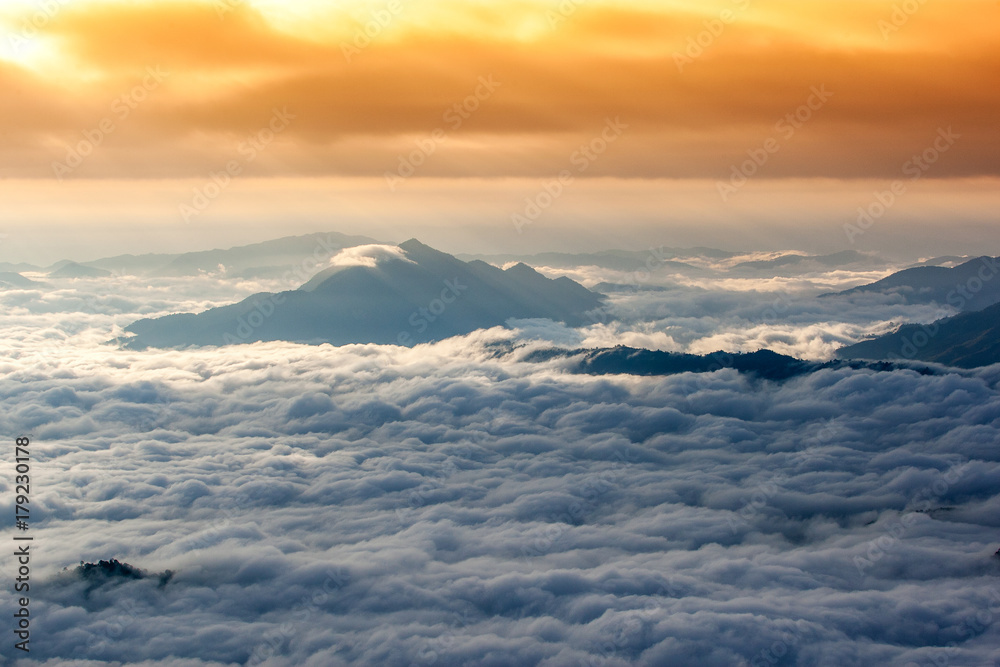 Beautiful landscape of mountain layer in morning sun ray and winter fog at Phu chi fa national forest park in ,Chiang Rai, Thailand Beautiful landscape of mountain layer in morning sun ray and winter fog at Phu chi fa national forest park in ,Chiang Rai, Thailand