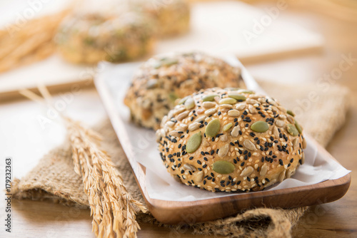 Multigrain mixed cereal seed healthy bread buns in wooden plate
