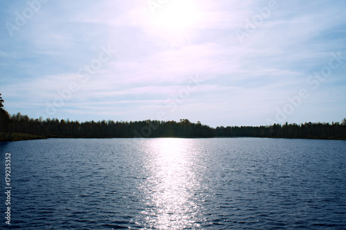 sun over an autumn lake