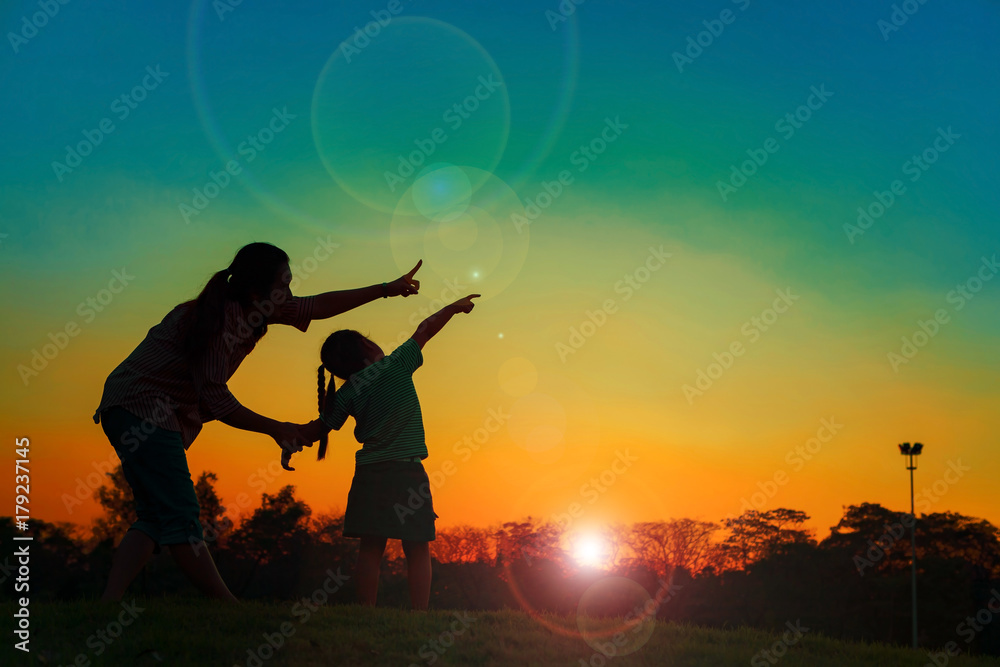 Silhouette healthy and daughter playing together. Silhouette healthy and daughter playing together.