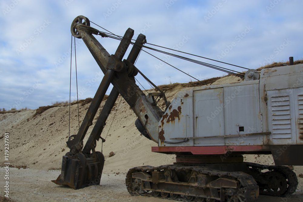 old abandoned yellow excavator in sandpit old abandoned yellow excavator in sandpit