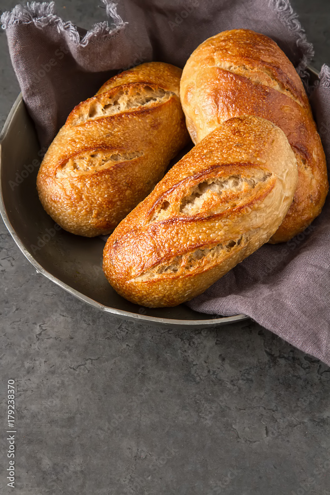 Homemade Italian bread. Fresh bakery. Dark background.