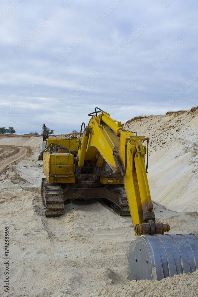 old abandoned yellow excavator in sandpit old abandoned yellow excavator in sandpit