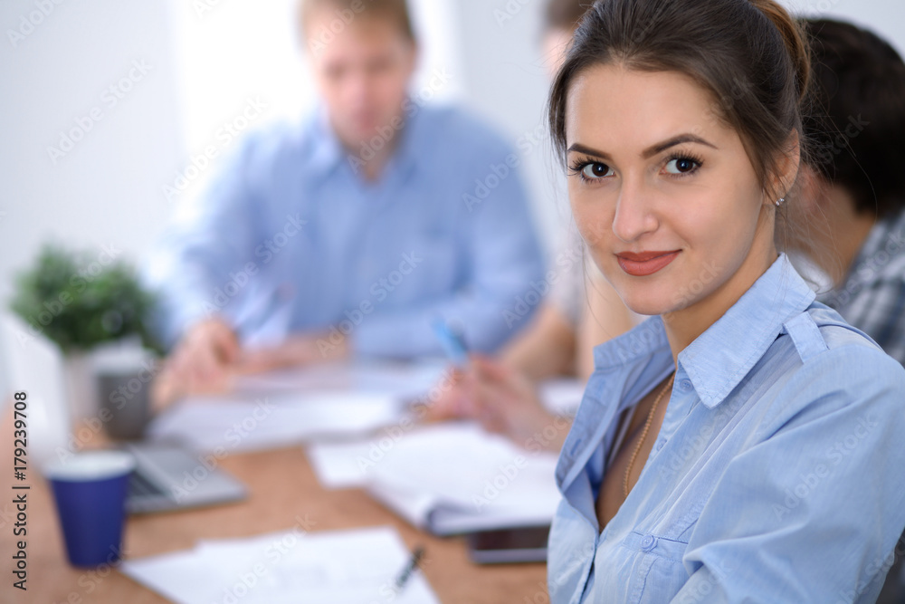 Beautiful business woman on the background of business people. Start up team. Beautiful business woman on the background of business people. Start up team.