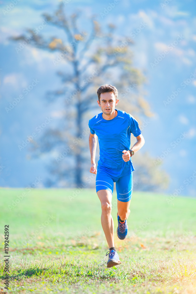 Athlete running in the mountains of the Italian national team in training Athlete running in the mountains of the Italian national team in training