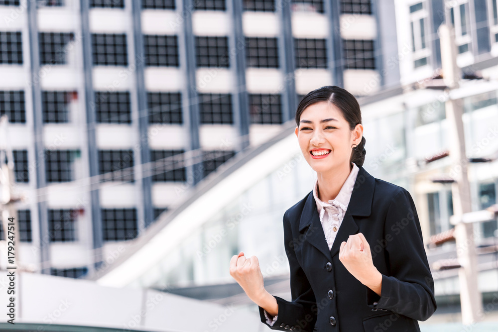 Successful business people celebrating with arms up Successful business people celebrating with arms up