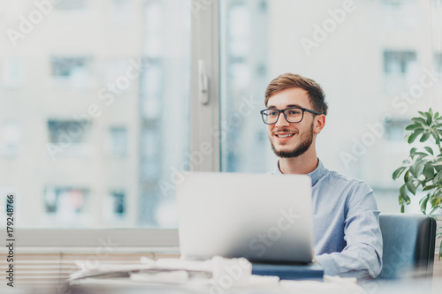 Intern doing research on laptop