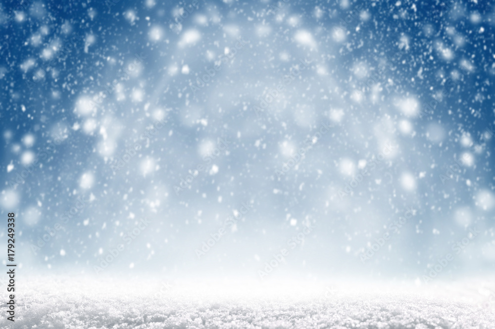 Winter christmas background with shiny snow and blizzard