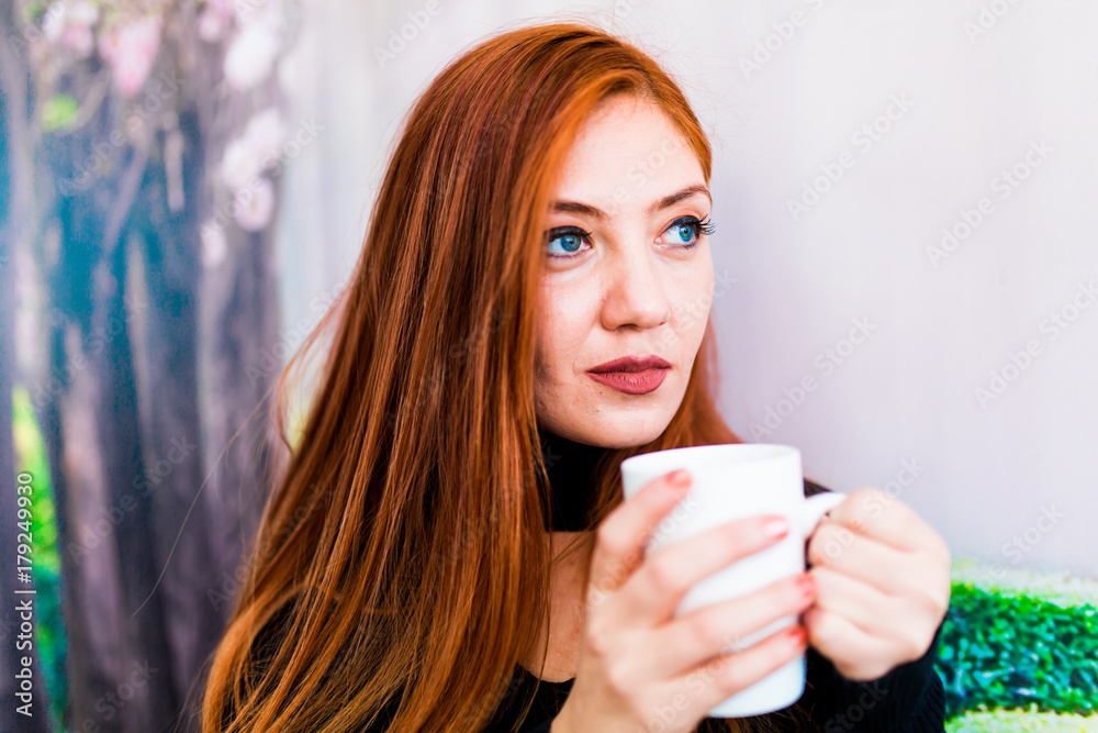 Beautiful girl drinking coffee at the coffee shop Beautiful girl drinking coffee at the coffee shop