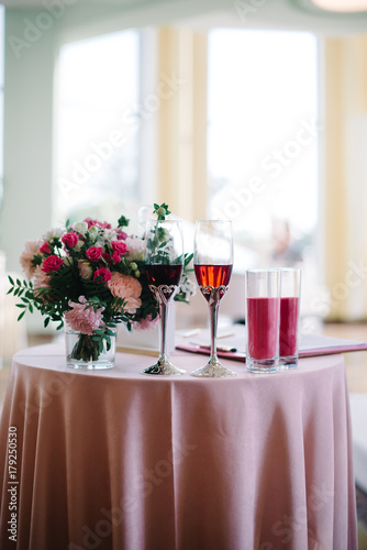 decorated wedding ceremony table glasses of wine