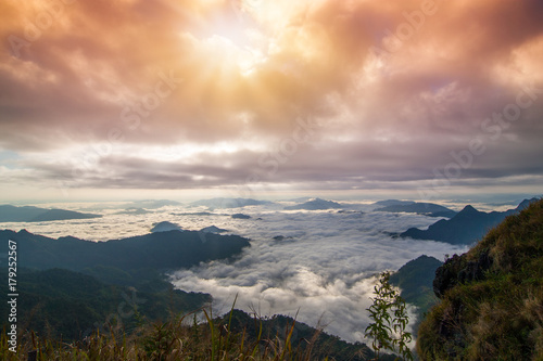 Beautiful landscape of mountain layer in morning sun ray and winter fog at Phu chi fa national forest park in ,Chiang Rai, Thailand
