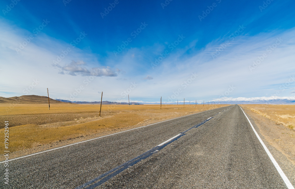 Federal highway M-52 Chuysky tract against the blue clear sky. Federal highway M-52 Chuysky tract against the blue clear sky.