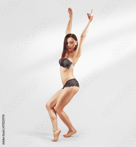 Fitness sporty girl dancing hip hop in the studio, urban style. Teen model in underwear posing.