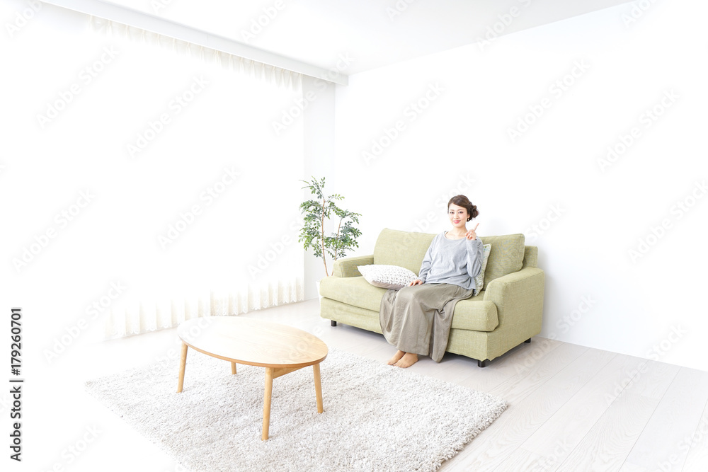 Woman pointing to something at home