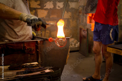 Glassworks glass manufacturing, process of forming a decorative vase 