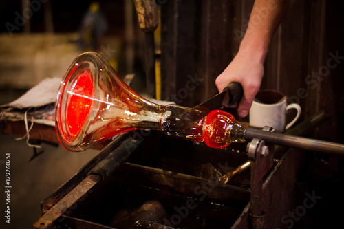 Glassworks glass manufacturing, process of forming a decorative vase 