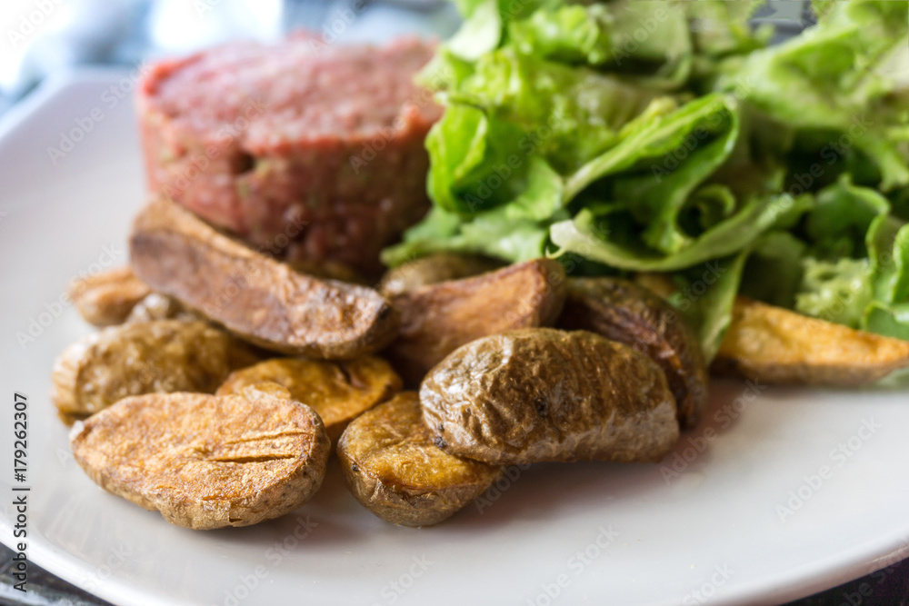 tasty Steak tartare (Raw beef) - classic steak tartare on white plate