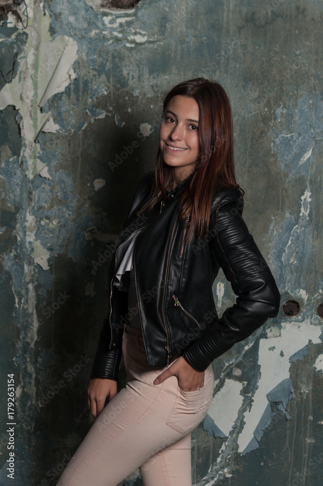 Fototapeta premium A girl in an old destroyed building