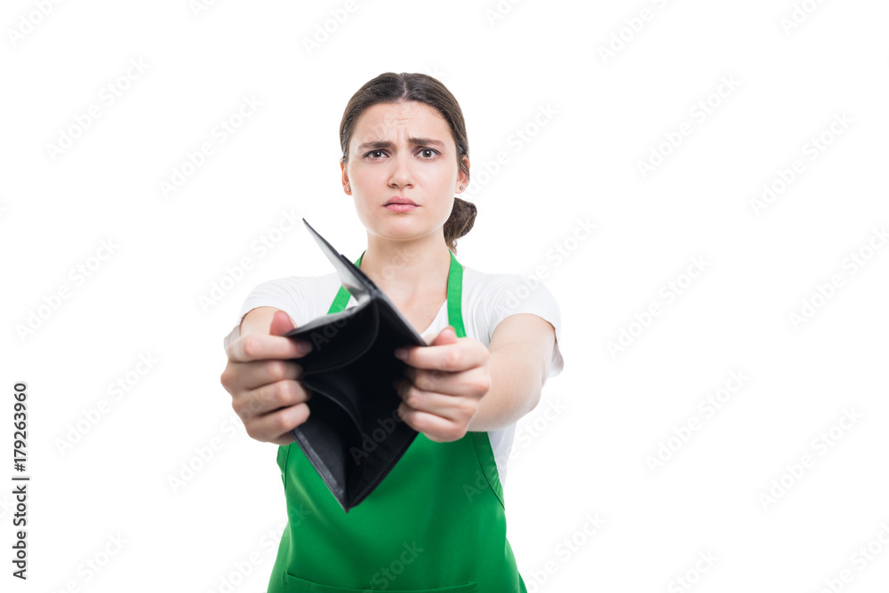Sad hypermarket seller showing empty wallet Sad hypermarket seller showing empty wallet
