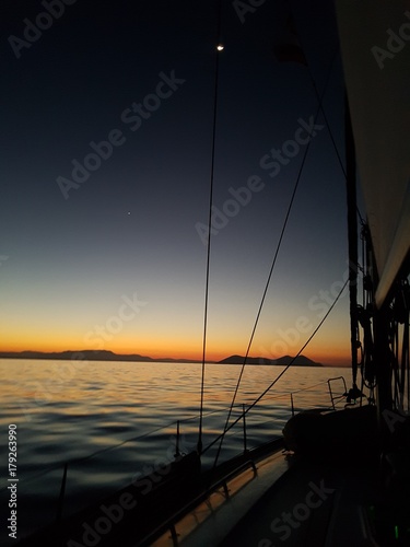 Night landscape with yachts, sea and rigging