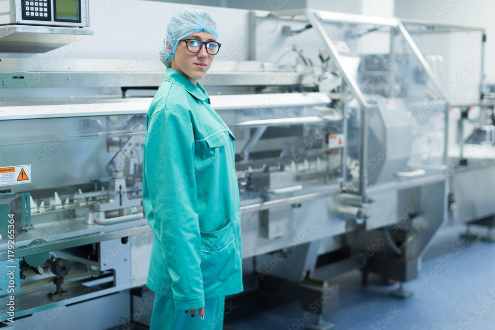 the operator controls the machine in the factory work the operator controls the machine in the factory work