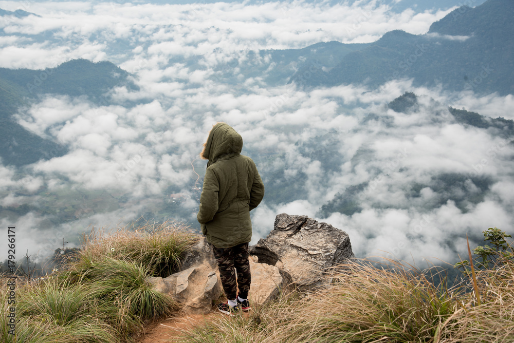 Tourist stand on view point at phu chi fah chiang rai Thailand