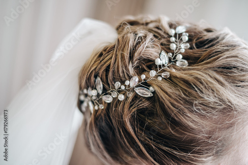 Beautiful fashionable hairstyle with an accessory made of stones