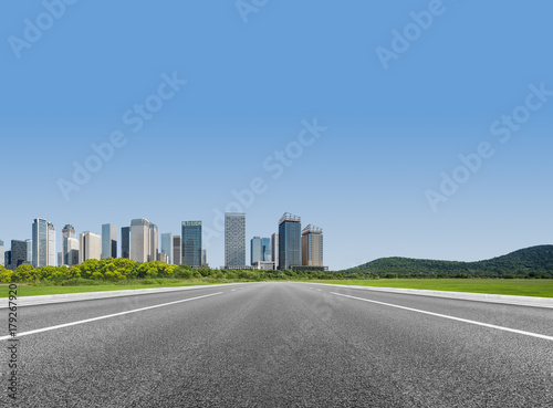 Fototapeta Naklejka Na Ścianę i Meble -  empty asphalt road through modern city in China..