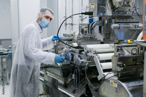 scientist work with manufacture machine