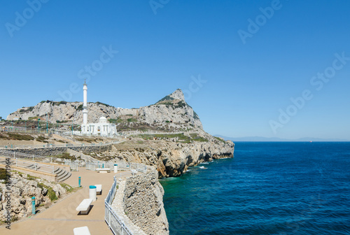 View of the rock of Gibraltar and the Ibrahim-al-Ibrahim Mosque (King Fahd bin Abdulaziz al-Saud Mosque) from Europa Point promenade. British Overseas Territory of Gibraltar.