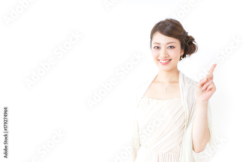 woman in dress pointing to something