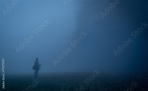 Tourist man in the nature a foggy day